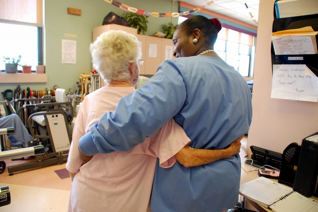 Patient and therapist hugging